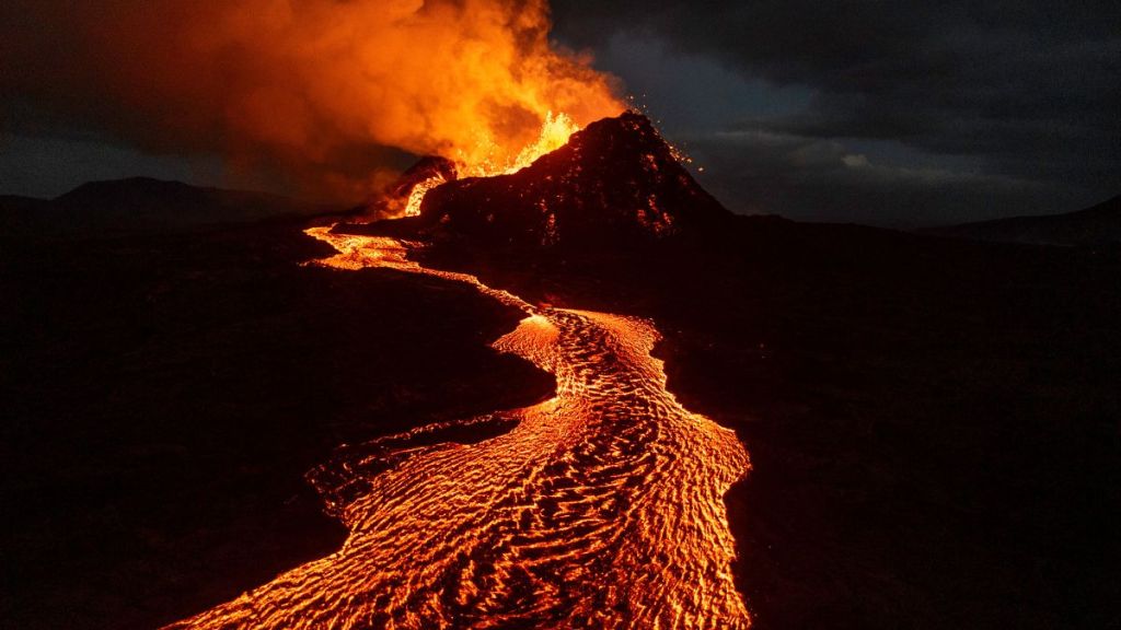 Seen from an aerial view, lava flows from the Sundhnúkur volcano on June 3, 2024 on the Reykjanes peninsula near Grindavik, Iceland. The volcano, which has erupted five times since December, has forced the evacuation of the southwestern fishing town of Grindavik as well as the nearby Blue Lagoon geothermal spa.