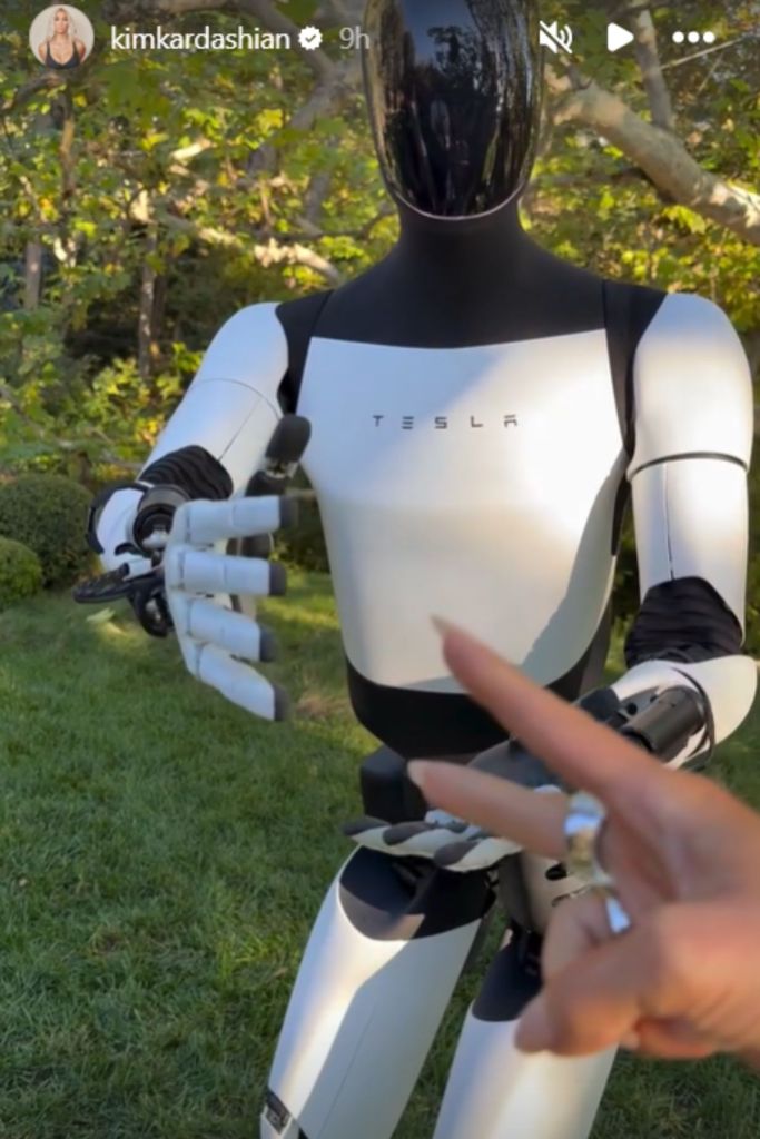 Kim Kardashian playing rock paper scissors with her new Tesla robot on her Instagram stories.