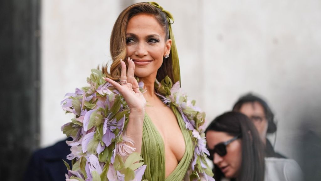 Jennifer Lopez Welcomes 2025 in Plunging Neon Green Dress